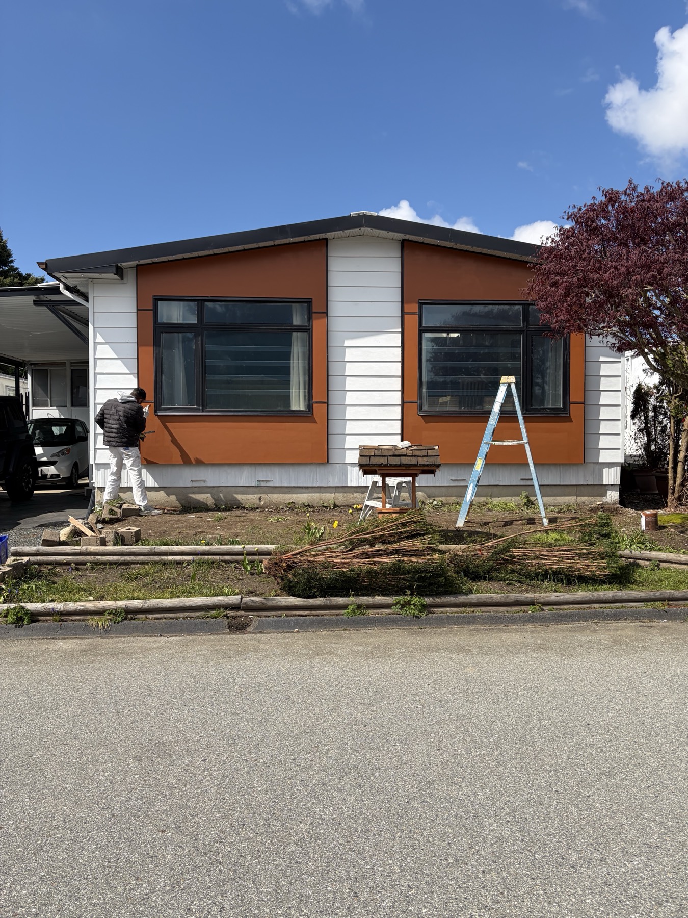 A modern exterior in warm panel and white