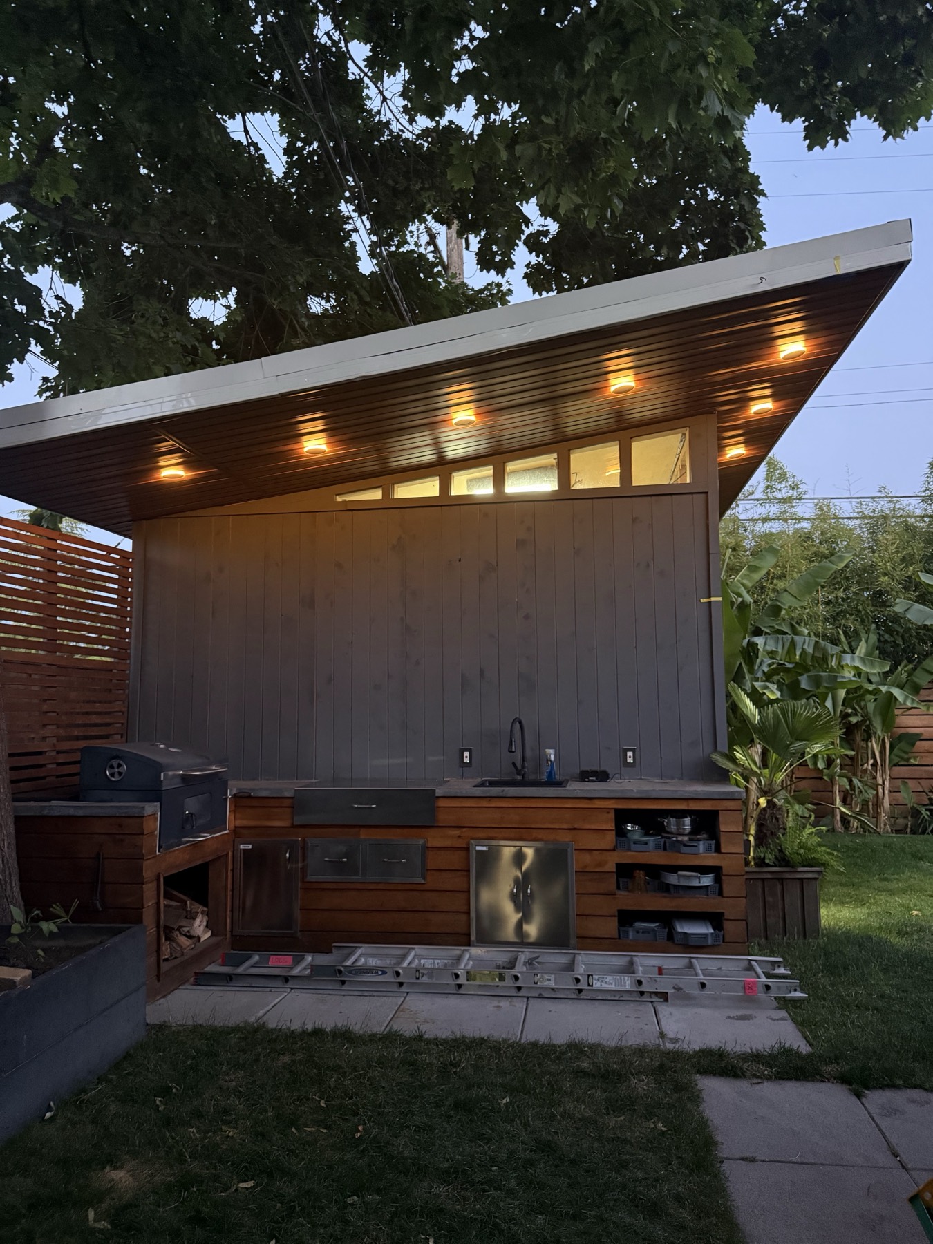 A covered outdoor space at dusk